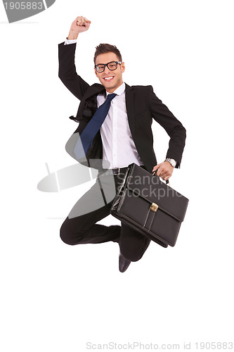Image of business man with briefcase jumping