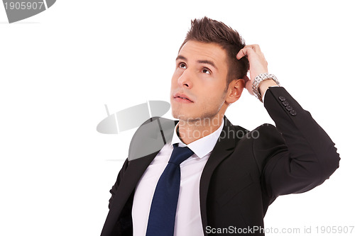 Image of young thoughtful businessman