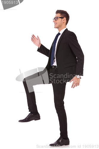 Image of business man stepping up