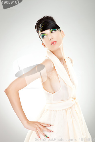 Image of side of a woman in dress