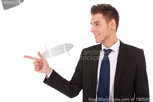Image of young business man pointing to the side