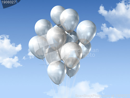 Image of white balloons on a blue sky