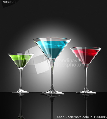Image of red, green and blue cocktail glasses