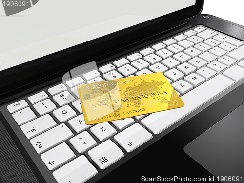 Image of gold credit card on laptop
