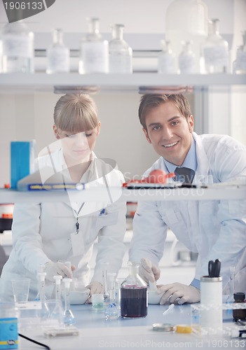 Image of science people in bright lab
