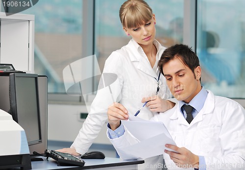 Image of science people in bright lab