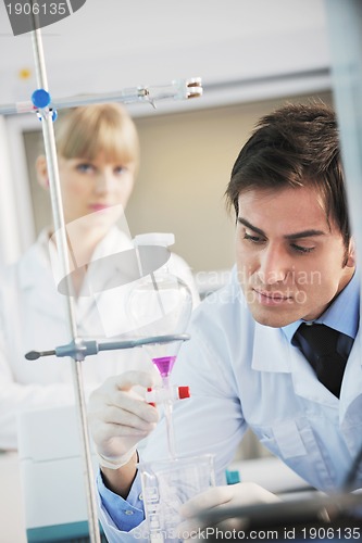 Image of science people in bright lab