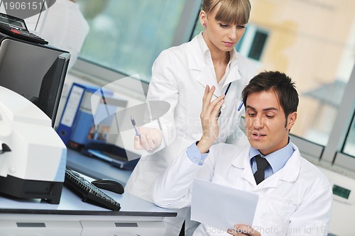 Image of science people in bright lab