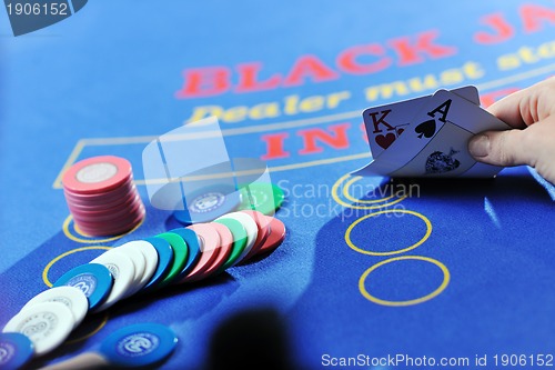 Image of woman play black jack card game in casino