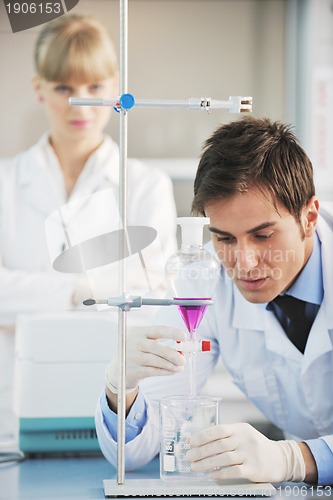 Image of science people in bright lab