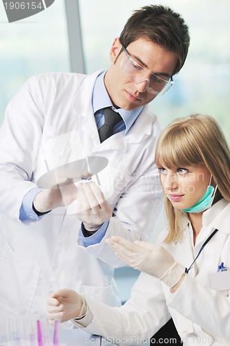 Image of science people in bright lab