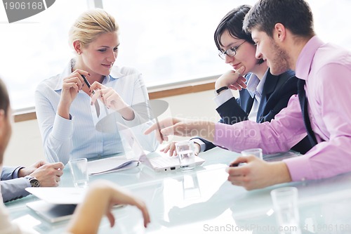 Image of group of business people at meeting