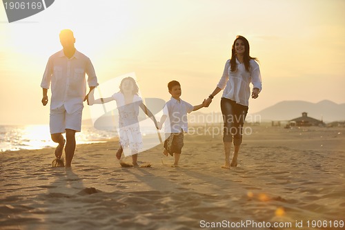 Image of happy young family have fun on beach