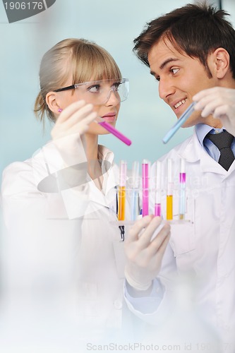 Image of science people in bright lab