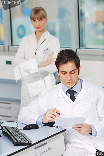Image of science people in bright lab