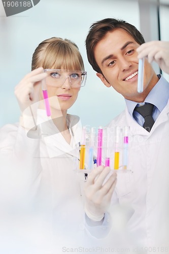 Image of science people in bright lab