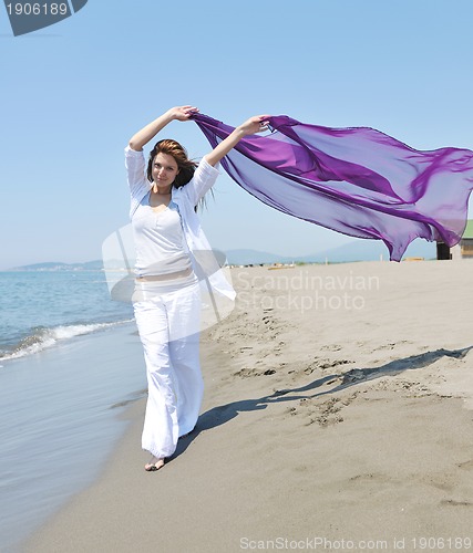 Image of young woman relax  on beach