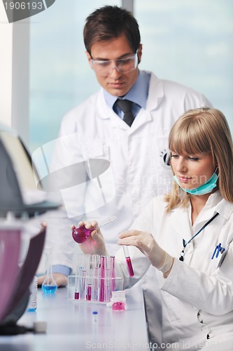 Image of science people in bright lab