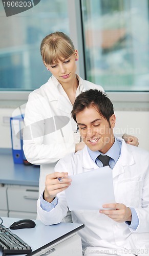 Image of science people in bright lab