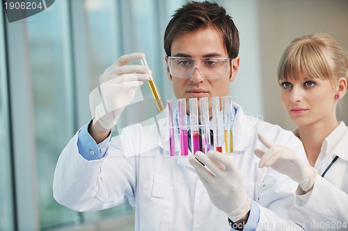 Image of science people in bright lab