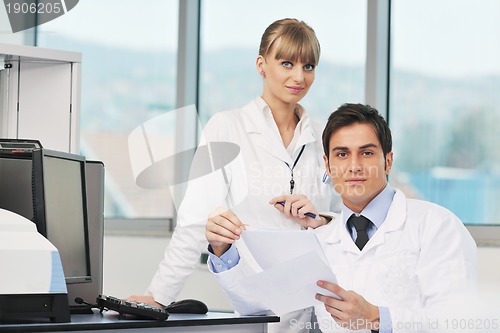 Image of science people in bright lab