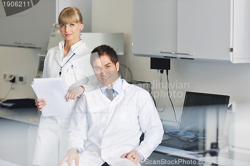 Image of science people in bright lab