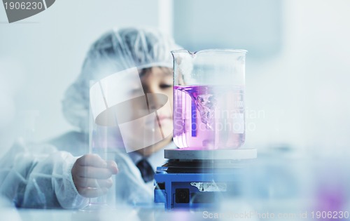 Image of little child scientist in lab