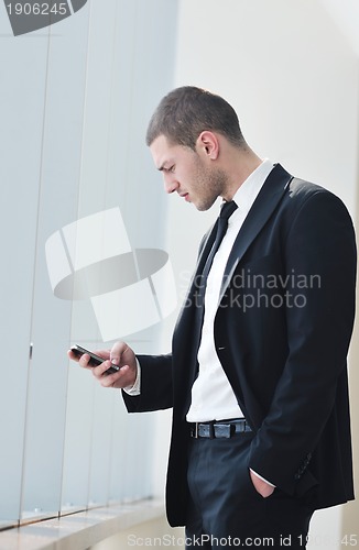 Image of young business man talk by cellphone