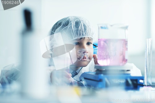 Image of little child scientist in lab