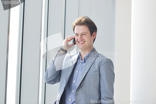 Image of young business man talk by cellphone