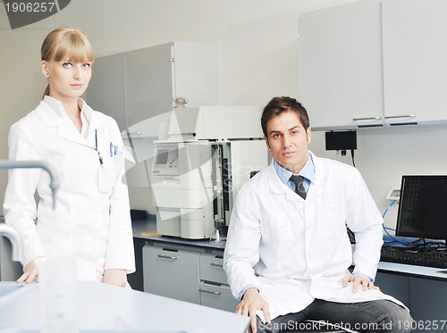 Image of science people in bright lab