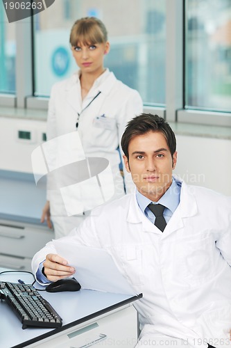 Image of science people in bright lab