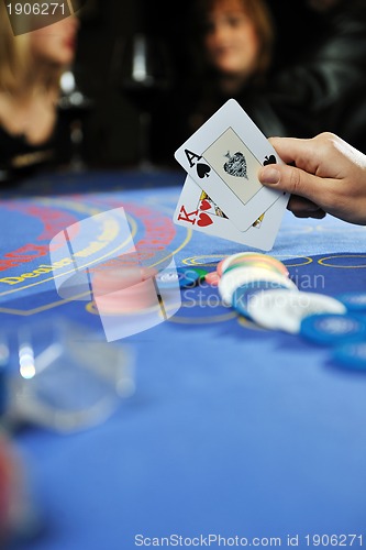 Image of woman play black jack card game in casino