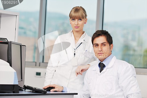 Image of science people in bright lab