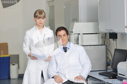 Image of science people in bright lab
