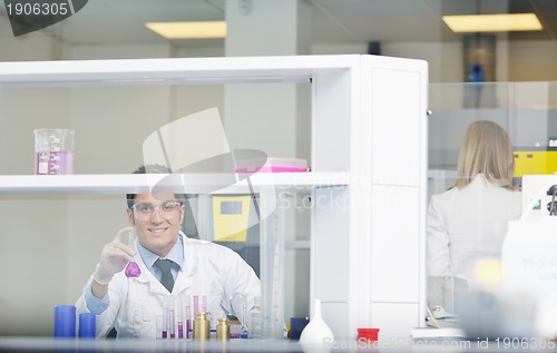 Image of science people in bright lab