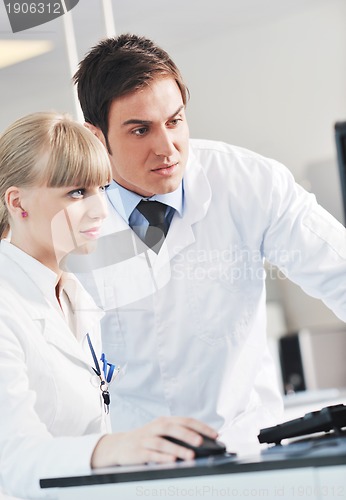 Image of science people in bright lab