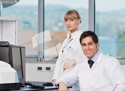 Image of science people in bright lab