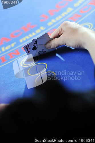 Image of woman play black jack card game in casino