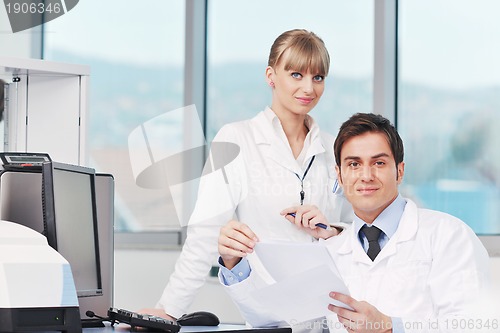 Image of science people in bright lab