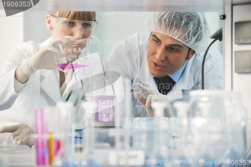 Image of science people in bright lab