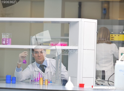 Image of science people in bright lab