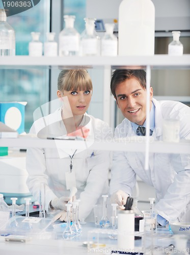 Image of science people in bright lab