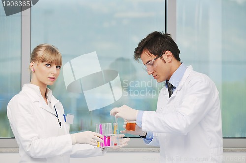 Image of science people in bright lab