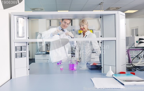 Image of science people in bright lab