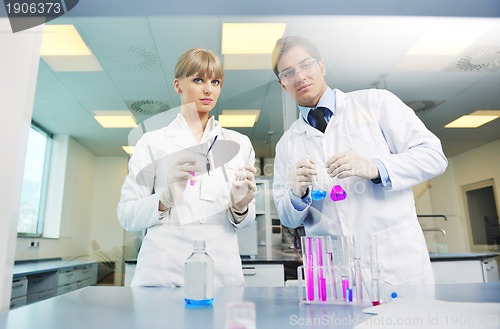 Image of science people in bright lab