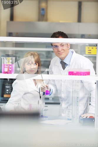 Image of science people in bright lab