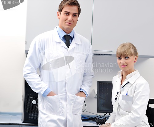 Image of science people in bright lab