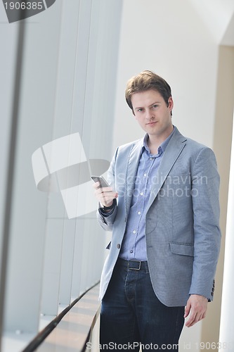 Image of young business man talk by cellphone