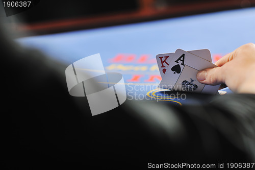 Image of woman play black jack card game in casino